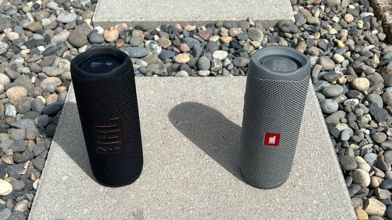 two jbl speakers standing up