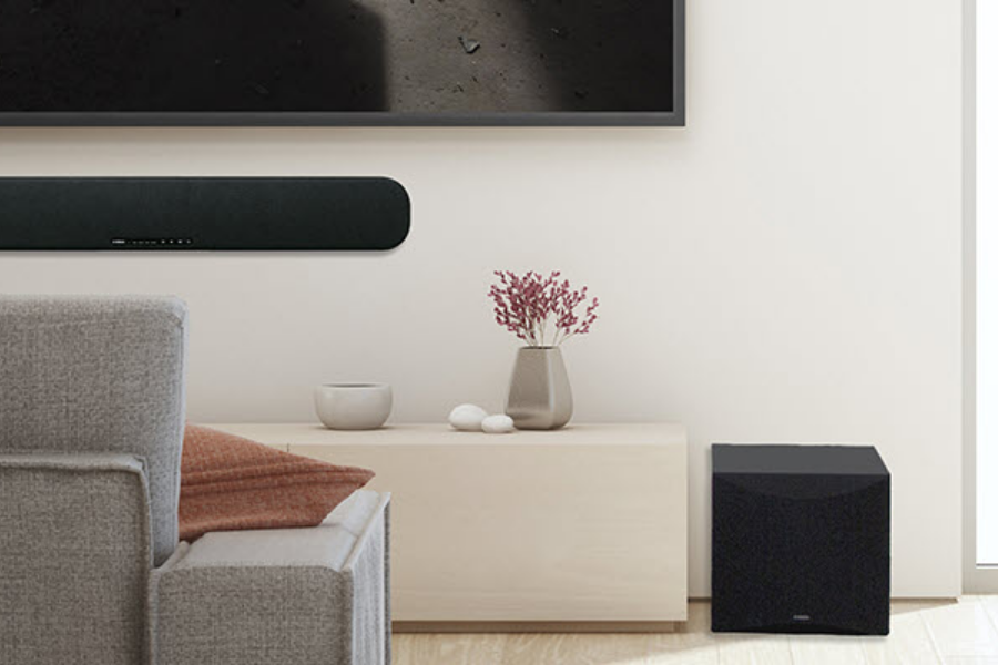 Put in a soundbar with a subwoofer.